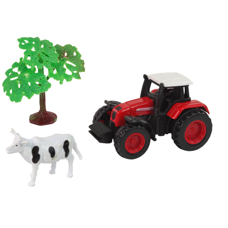 Traktors ar piekabi un govi