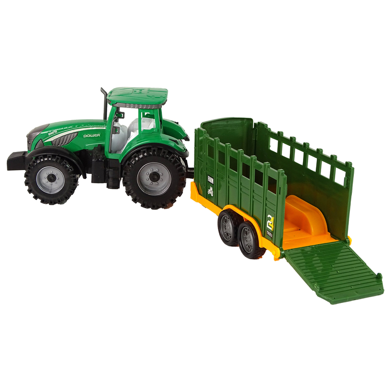 Zaļš traktors ar noņemamu piekabi ar berzes piedziņu
