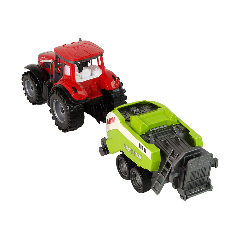 Sarkans lauksaimniecības traktors ar zaļu sējmašīnu ar berzes piedziņu
