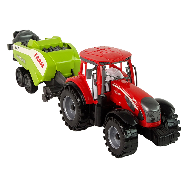 Sarkans lauksaimniecības traktors ar zaļu sējmašīnu ar berzes piedziņu